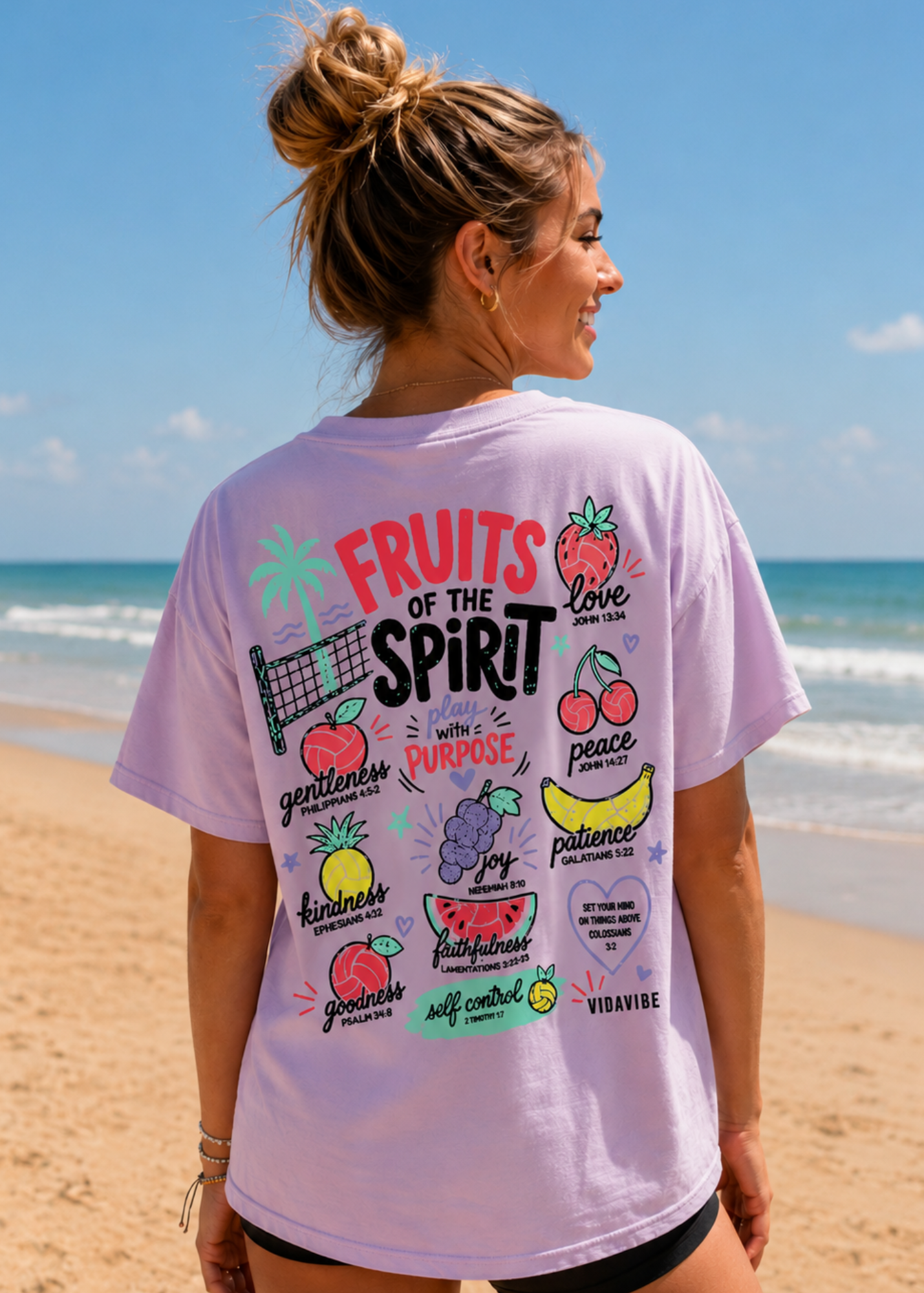 Woman wearing a 'Fruits of the Spirit' t-shirt volleyball shirt on a beach