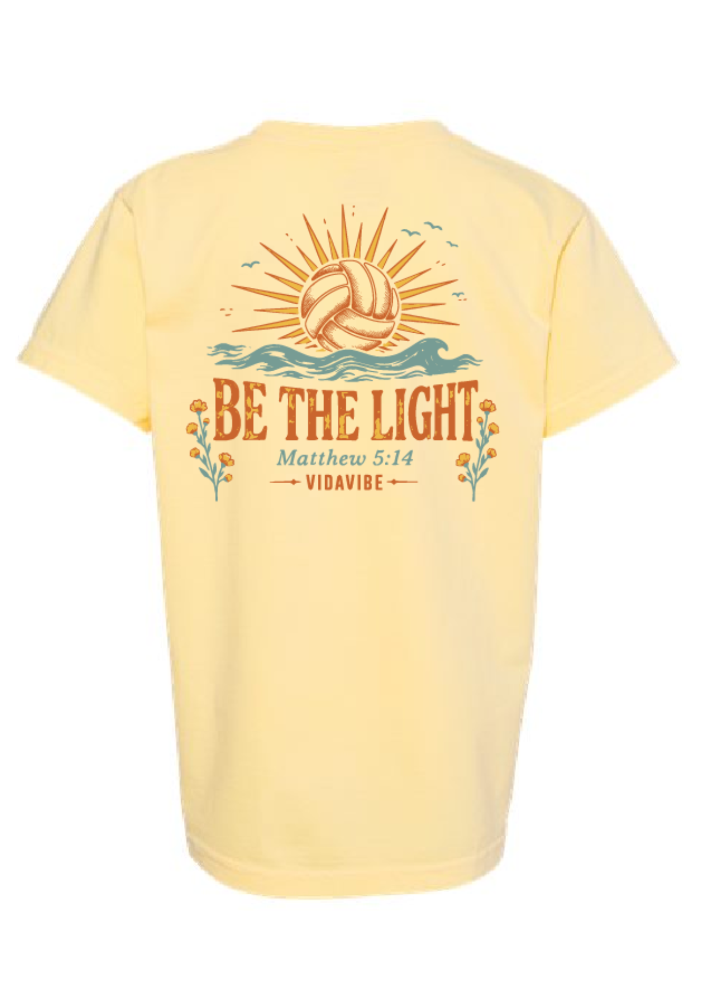 A pale yellow short-sleeve t-shirt shown from the back, featuring a retro-style graphic of a volleyball under a sunburst with the text 'BE THE LIGHT Matthew 5:14 VIDAVIBE'.