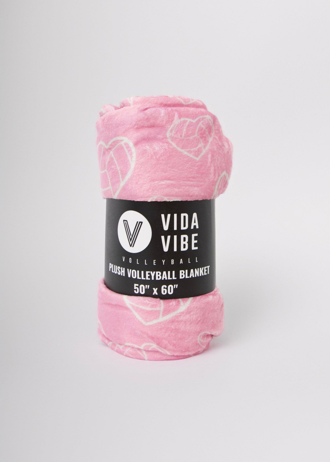 Pink volleyball heart blanket with 'Vida Vibe' label on a white background