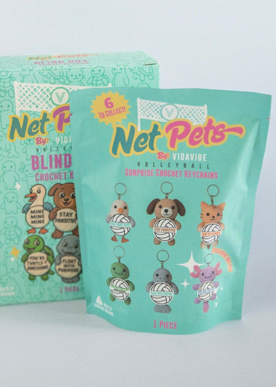Teal packaging of Net Pets by Vidavibe Volleyball with volleyball cartoon characters