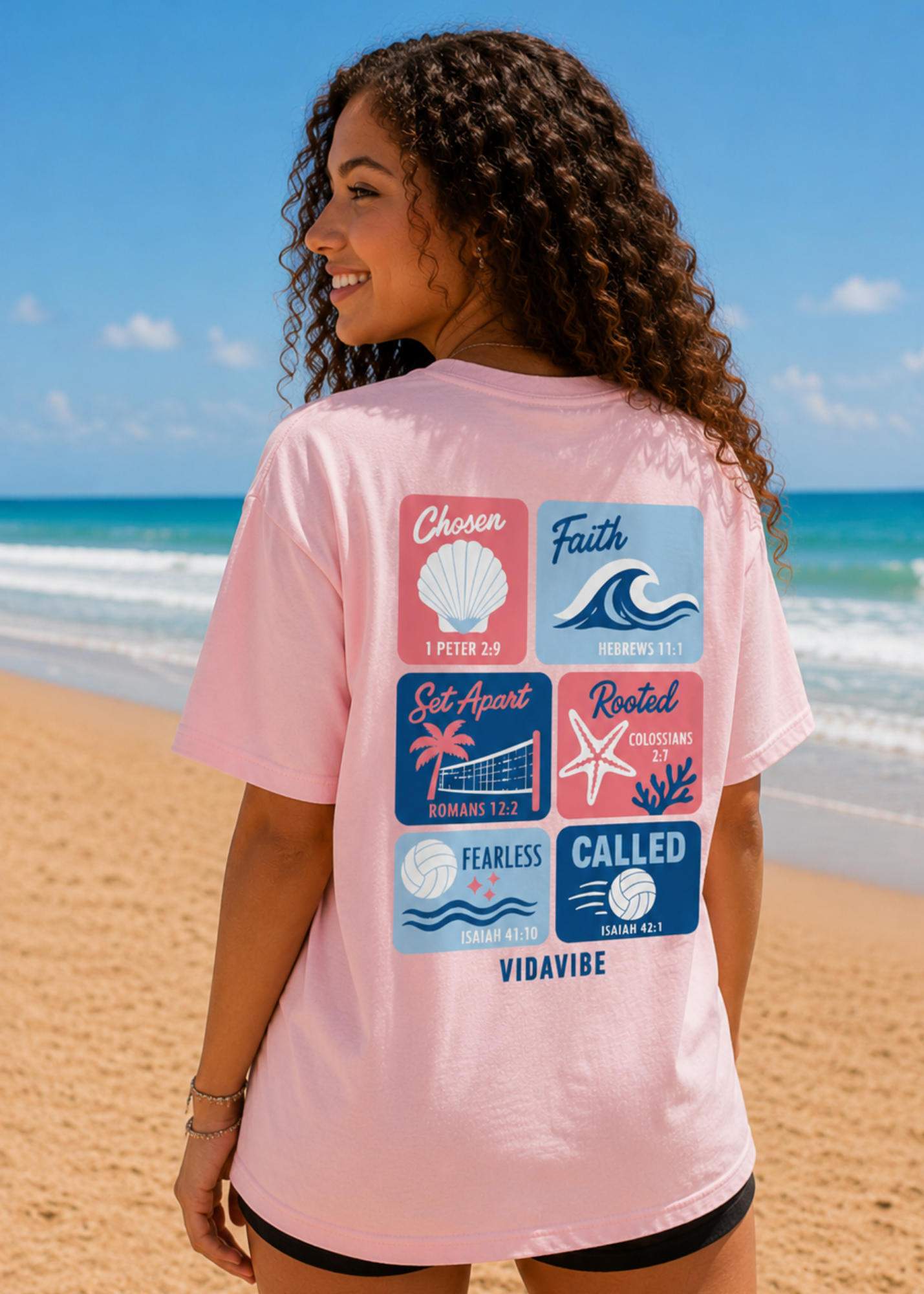 Woman wearing a pink t-shirt with motivational phrases on a beach