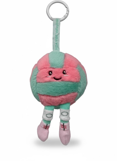 Plush volleyball with a pink and green design on a gray background