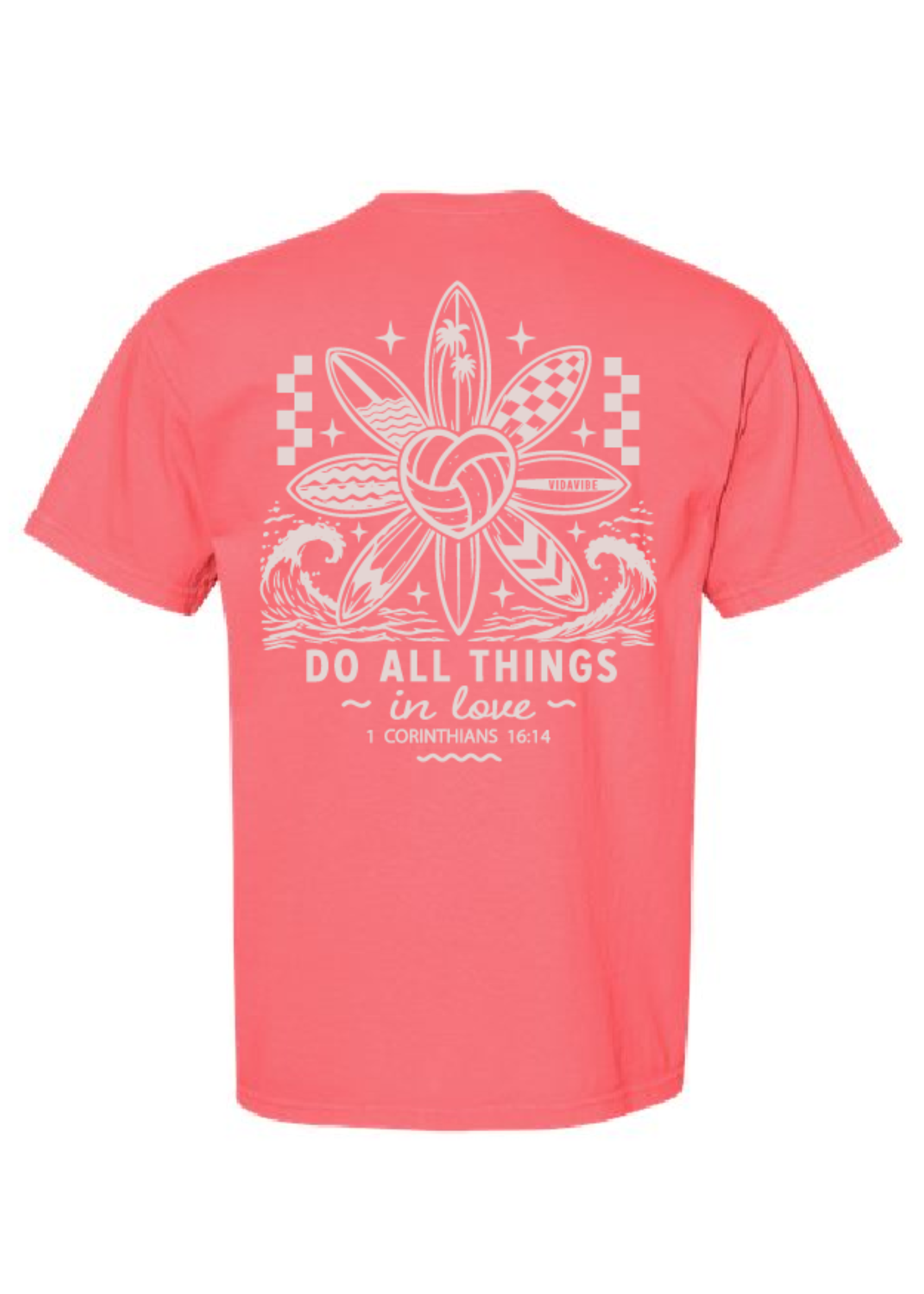 A coral pink short-sleeve t-shirt shown from the back, featuring a large white graphic print of a volleyball surrounded by surfboards and the text 'DO ALL THINGS in love 1 CORINTHIANS 16:14'.